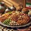 افزودن پودر آجیل به ماست و میوه، یک روش ایمن و مقوی برای صبحانه کودکان.